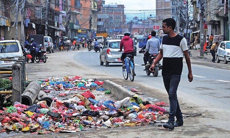 Garbage piles feeding river pollution in Capital city.